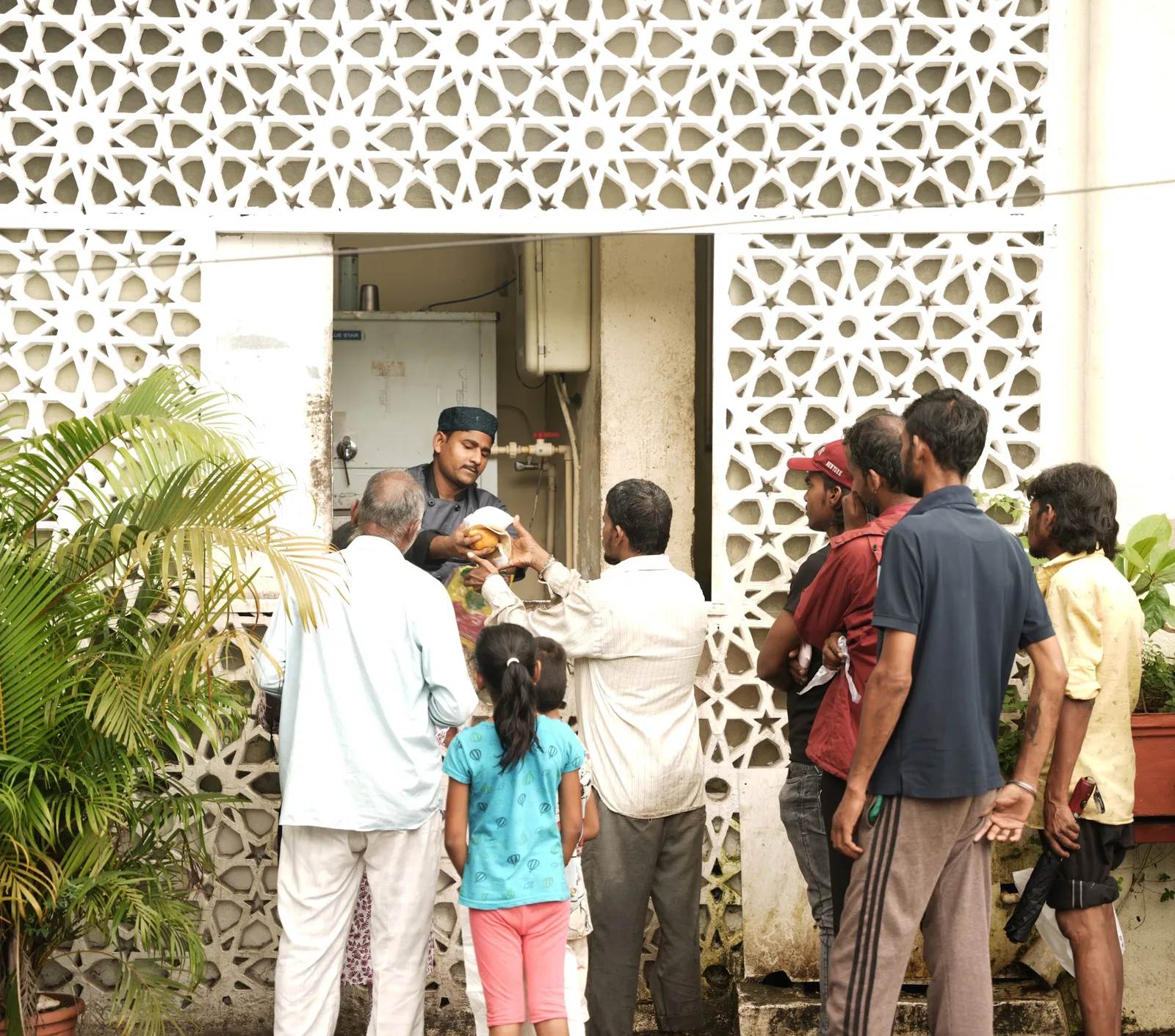 Volunteers serving meals at the Niyaaz centre